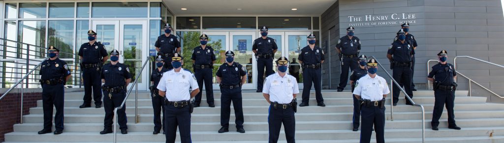 A group of police officers standing in unison.